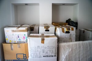 multiple white packed boxes sitting in room